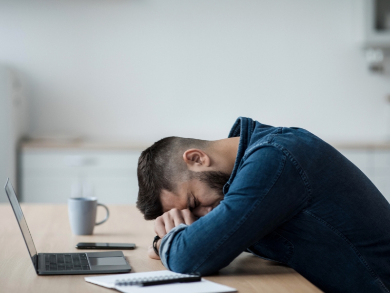a man sleeping on his head